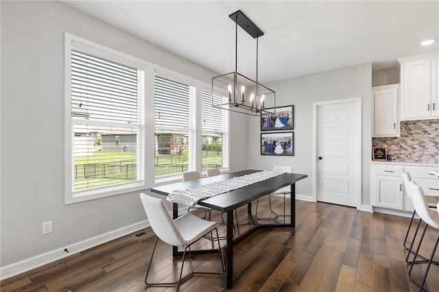 16780 W 170th Ct, Olathe, KS 66062 - dining room featuring a chandelier, plenty of natural light, dark wood-style floors, and baseboards