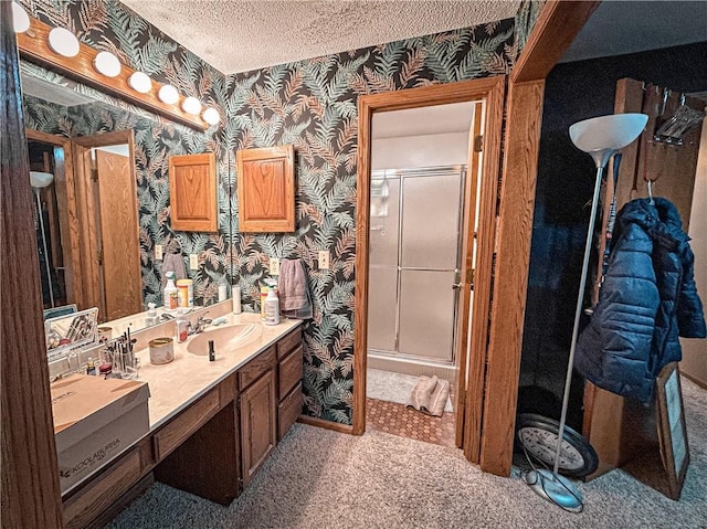 12100 Hedge Lane Ter, Olathe, KS 66061 - bathroom with wallpapered walls, a shower stall, vanity, and a textured ceiling