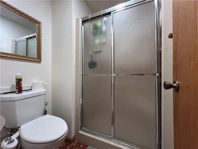 12100 Hedge Lane Ter, Olathe, KS 66061 - full bath with an enclosed shower, toilet, and tile patterned flooring