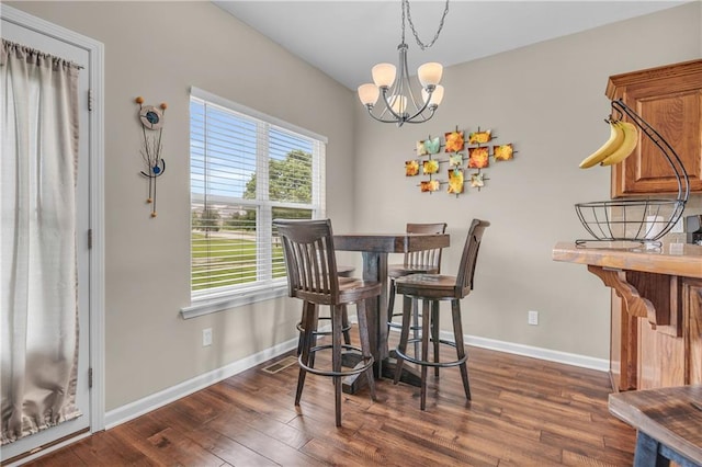 21923 W 116th Pl, Olathe, KS 66061 - dining space with a chandelier, dark wood-style floors, and baseboards