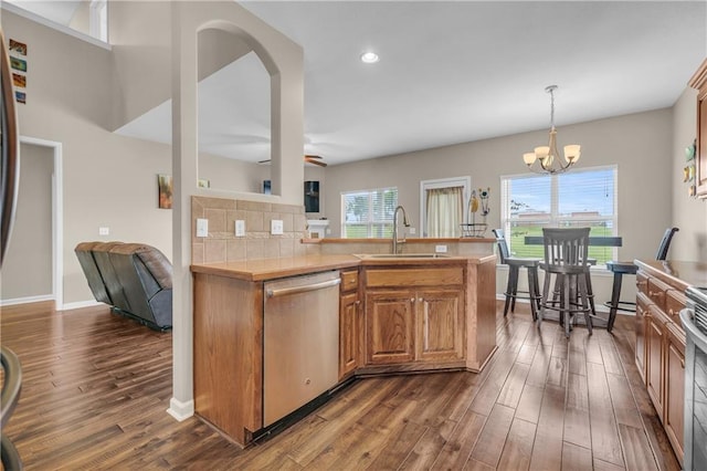 21923 W 116th Pl, Olathe, KS 66061 - kitchen with a sink, dishwasher, dark wood-type flooring, a chandelier, and recessed lighting