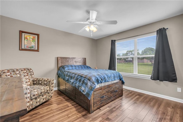 21923 W 116th Pl, Olathe, KS 66061 - bedroom featuring baseboards, wood finished floors, and a ceiling fan