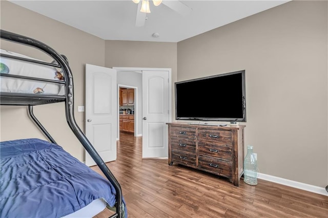21923 W 116th Pl, Olathe, KS 66061 - bedroom featuring wood finished floors, ceiling fan, and baseboards
