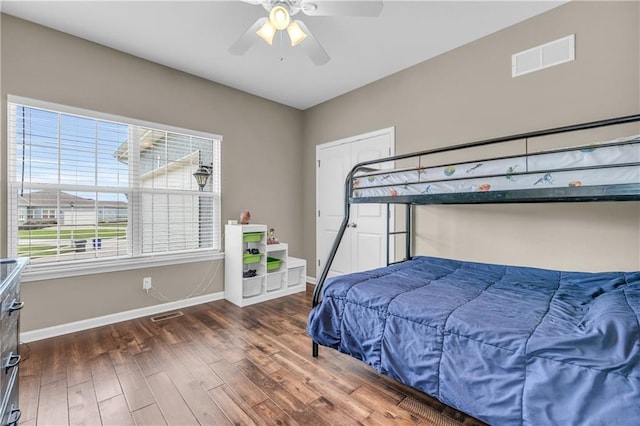 21923 W 116th Pl, Olathe, KS 66061 - bedroom with wood finished floors, baseboards, and ceiling fan