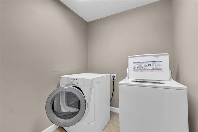 21923 W 116th Pl, Olathe, KS 66061 - washroom with separate washer and dryer, light tile patterned floors, and baseboards