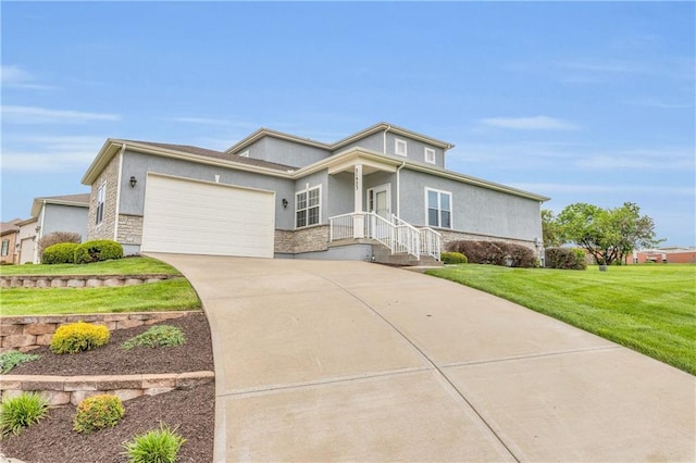 21923 W 116th Pl, Olathe, KS 66061 - view of front of property featuring concrete driveway, an attached garage, a front yard, and stucco siding