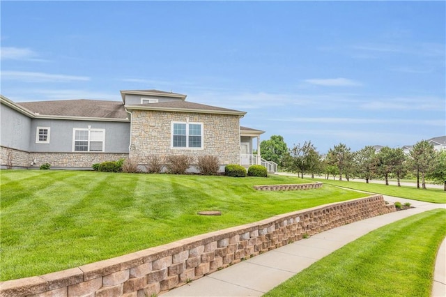 21923 W 116th Pl, Olathe, KS 66061 - view of front of property with stone siding, a front lawn, and stucco siding