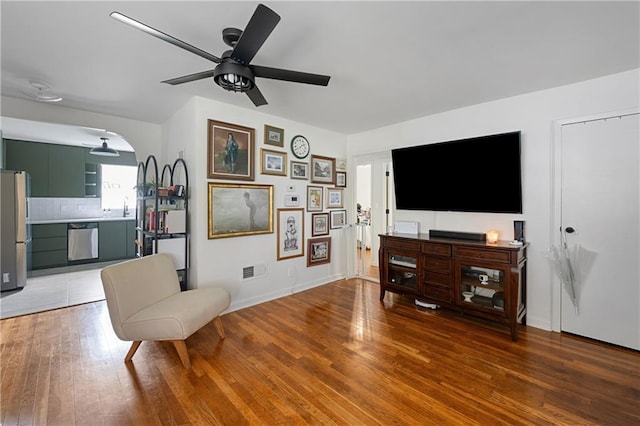 831 E 25th Ave, North Kansas City, MO 64116 - sitting room with a ceiling fan, light wood-style flooring, and baseboards