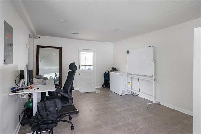831 E 25th Ave, North Kansas City, MO 64116 - tiled office space featuring electric panel, baseboards, and recessed lighting