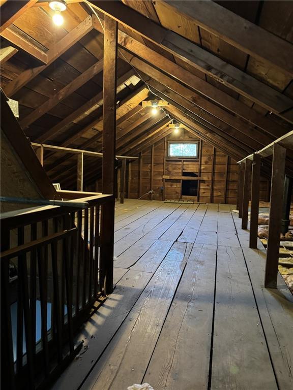 attic featuring an upstairs landing