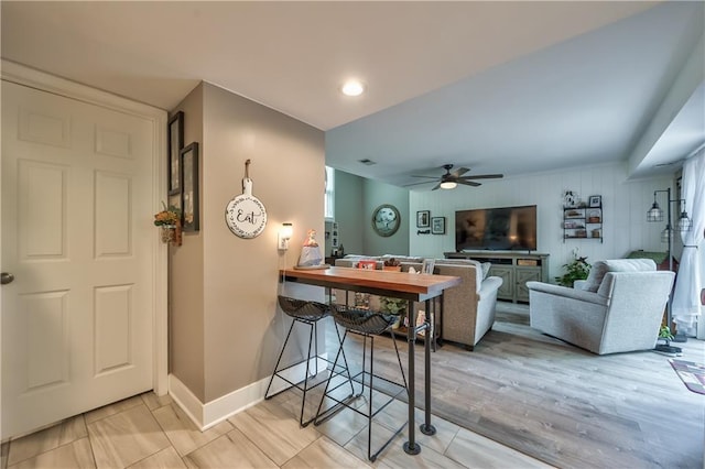 12735 W 108th Pl, Overland Park, KS 66210 - living area with a ceiling fan and baseboards