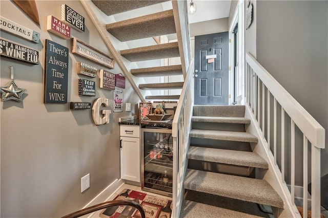 12735 W 108th Pl, Overland Park, KS 66210 - staircase with baseboards, beverage cooler, and a bar