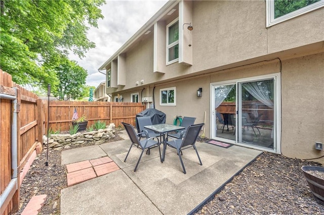 12735 W 108th Pl, Overland Park, KS 66210 - view of patio / terrace with a fenced backyard, outdoor dining space, and grilling area