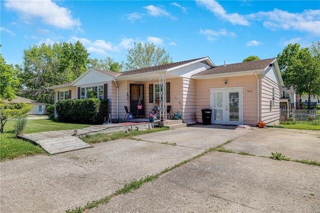 603 W 30th St, Higginsville, MO 64037 - view of front of property featuring french doors