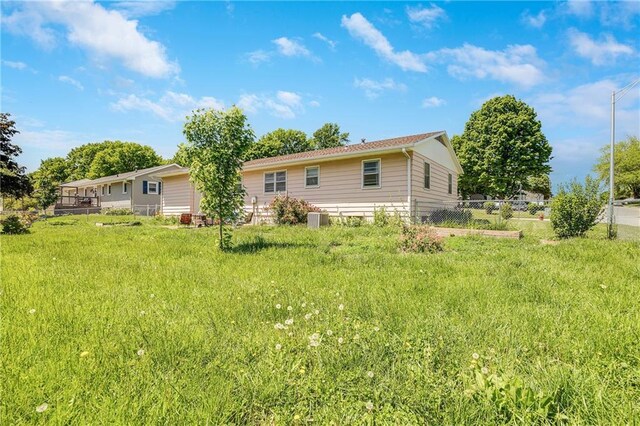 603 W 30th St, Higginsville, MO 64037 - rear view of house with cooling unit