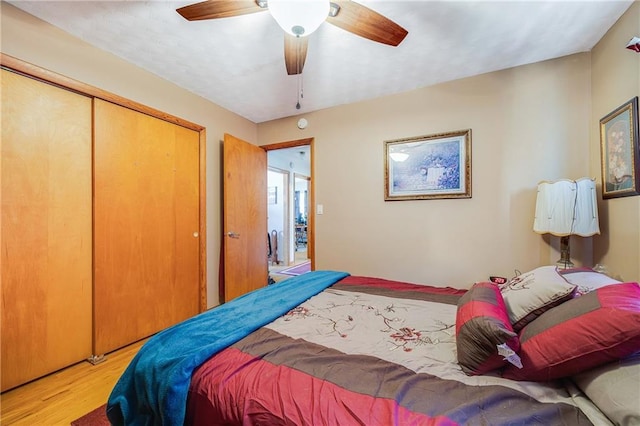 603 W 30th St, Higginsville, MO 64037 - bedroom featuring wood finished floors, a closet, and a ceiling fan