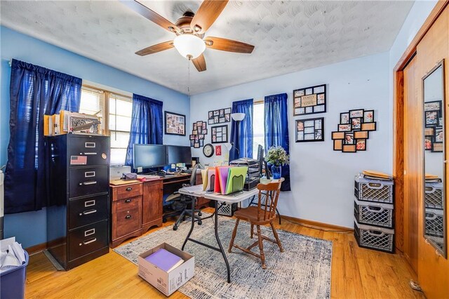 603 W 30th St, Higginsville, MO 64037 - home office featuring ceiling fan, light wood-type flooring, and baseboards