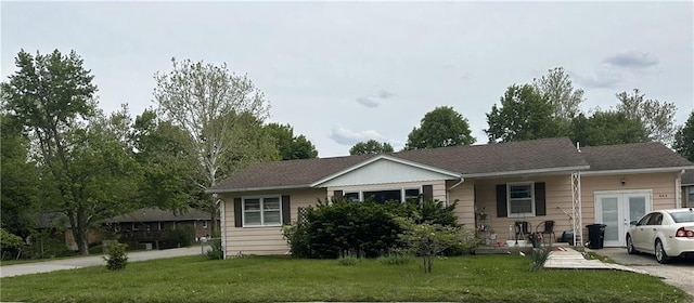 603 W 30th St, Higginsville, MO 64037 - view of front of house featuring a front lawn