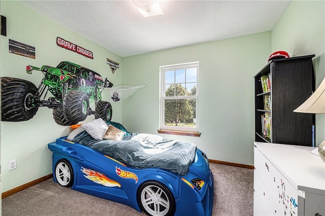 carpeted bedroom with a textured ceiling and baseboards