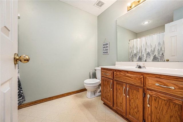 full bath featuring tile patterned floors, toilet, vanity, and baseboards