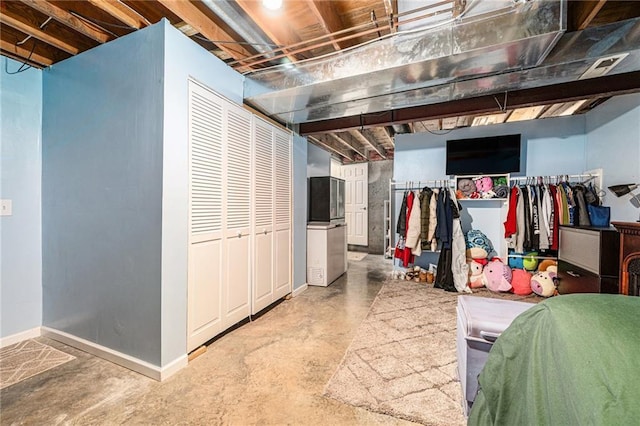 unfinished basement featuring baseboards