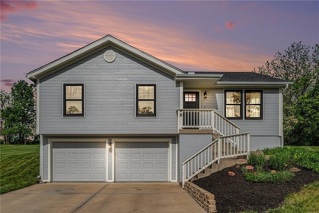 ranch-style home featuring an attached garage and driveway