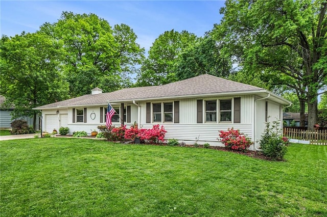 ranch-style home featuring an attached garage, concrete driveway, and a chimney