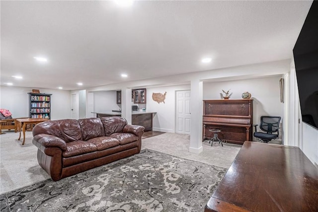 living room with carpet flooring, recessed lighting, and baseboards