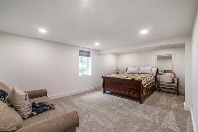 carpeted bedroom featuring baseboards and recessed lighting