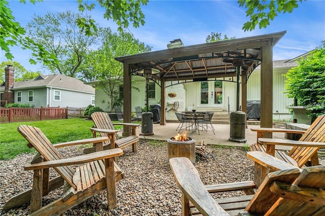 view of patio / terrace featuring a fire pit and a gazebo