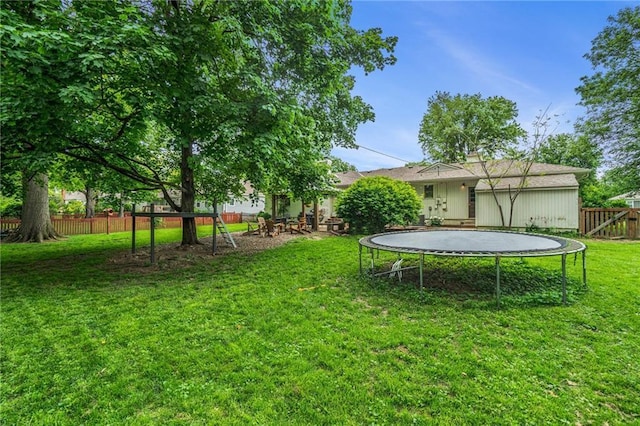 view of yard featuring a trampoline