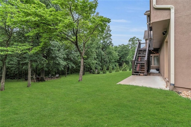8129 Clearwater Pt, Parkville, MO 64152 - view of grassy yard with stairs and a patio area
