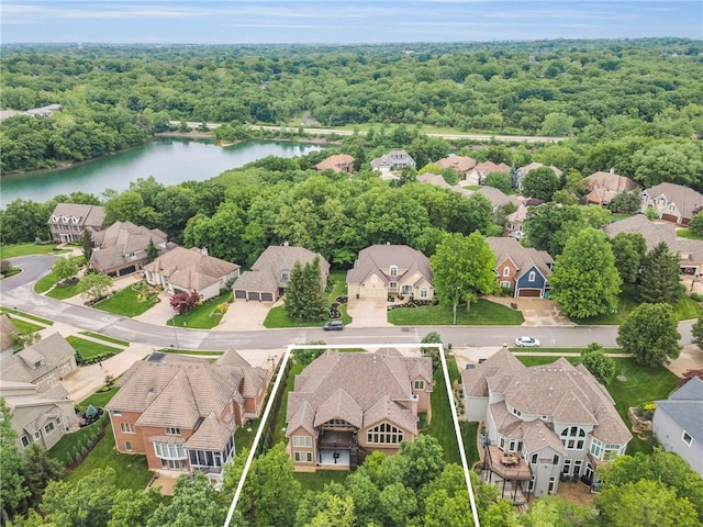 8129 Clearwater Pt, Parkville, MO 64152 - aerial perspective of suburban area with property boundaries highlighted and a large body of water