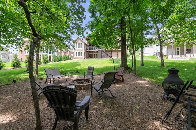 8129 Clearwater Pt, Parkville, MO 64152 - view of green lawn featuring an outdoor fire pit and stairway
