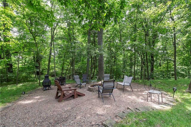8129 Clearwater Pt, Parkville, MO 64152 - view of patio / terrace featuring an outdoor fire pit