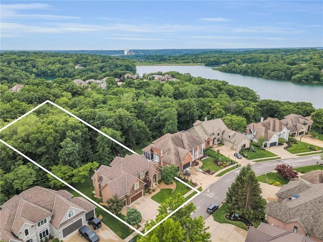 8129 Clearwater Pt, Parkville, MO 64152 - aerial view of residential area with a nearby body of water and property parcel outlined