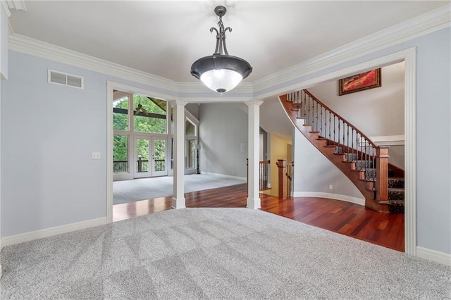 8129 Clearwater Pt, Parkville, MO 64152 - empty room with carpet floors, decorative columns, crown molding, stairs, and french doors