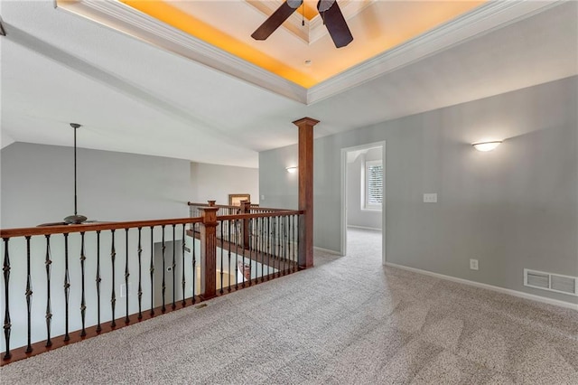 8129 Clearwater Pt, Parkville, MO 64152 - carpeted spare room with a ceiling fan, a raised ceiling, ornamental molding, and decorative columns