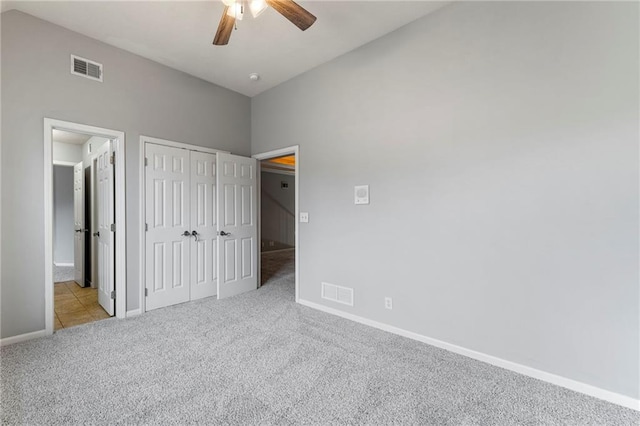 8129 Clearwater Pt, Parkville, MO 64152 - unfurnished bedroom with carpet, a closet, and ceiling fan