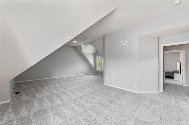 8129 Clearwater Pt, Parkville, MO 64152 - unfurnished living room with carpet floors, vaulted ceiling, and a ceiling fan