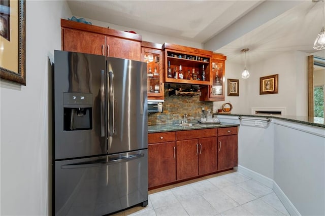 8129 Clearwater Pt, Parkville, MO 64152 - kitchen with refrigerator with ice dispenser, backsplash, light tile patterned floors, dark stone countertops, and decorative light fixtures