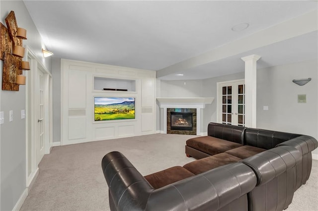 8129 Clearwater Pt, Parkville, MO 64152 - living area featuring carpet floors, a glass covered fireplace, and built in features