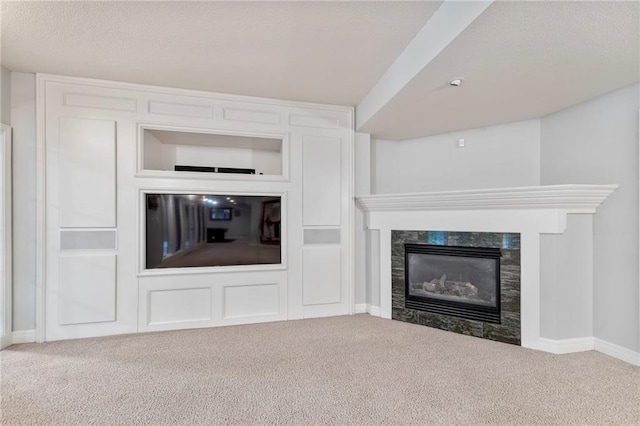 8129 Clearwater Pt, Parkville, MO 64152 - unfurnished living room featuring carpet floors, a fireplace, and a textured ceiling