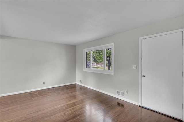 4203 E 113th St, Kansas City, MO 64137 - unfurnished room with wood finished floors and baseboards