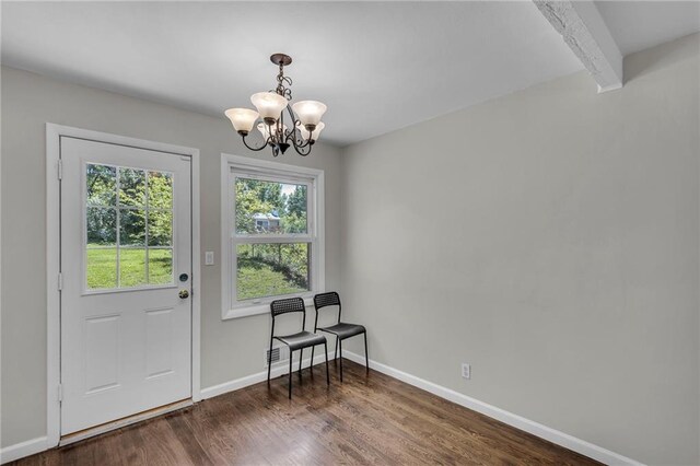 4203 E 113th St, Kansas City, MO 64137 - doorway to outside with plenty of natural light, a chandelier, dark wood-type flooring, baseboards, and beamed ceiling