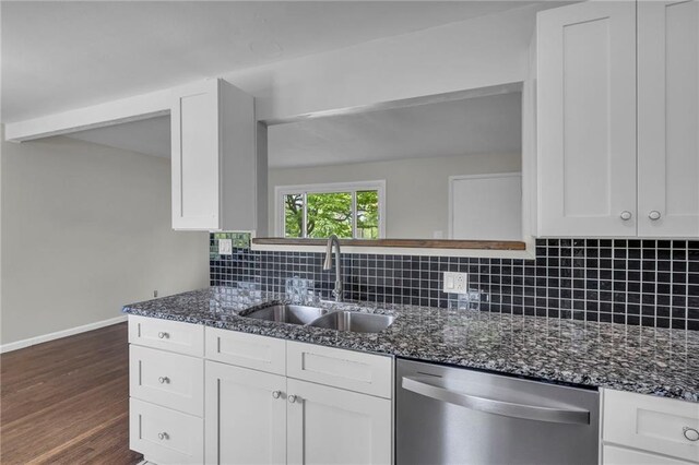 4203 E 113th St, Kansas City, MO 64137 - kitchen featuring dishwasher, a sink, white cabinets, and dark stone counters
