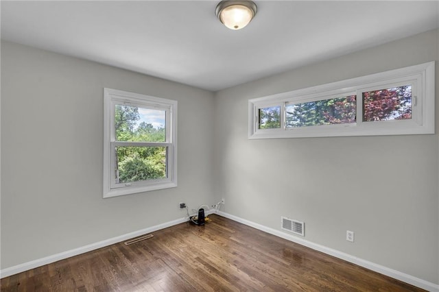 4203 E 113th St, Kansas City, MO 64137 - unfurnished room with baseboards and wood finished floors