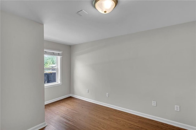 4203 E 113th St, Kansas City, MO 64137 - empty room featuring wood finished floors and baseboards