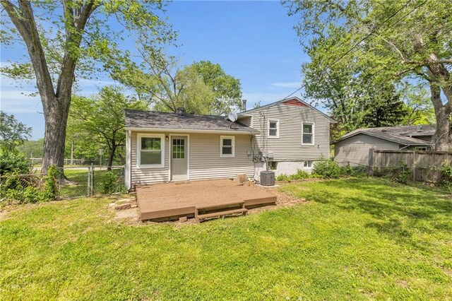 4203 E 113th St, Kansas City, MO 64137 - rear view of property with a wooden deck, central AC, and a gate