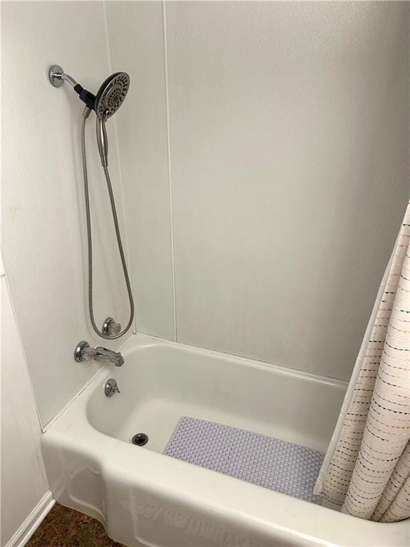 11305 E Winner Rd, Independence, MO 64052 - bathroom featuring baseboards and shower / bathtub combination with curtain
